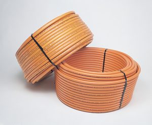 Rolls of Kitec piping before being installed