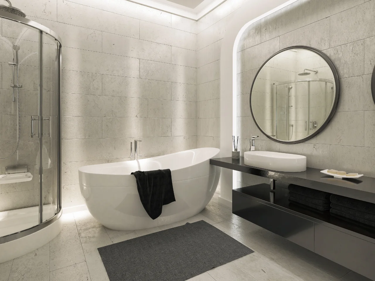 Modern bathroom with a freestanding white tub, a black towel draped on the side, a round mirror above a sleek black vanity with a white sink, and a glass-enclosed shower in the corner.